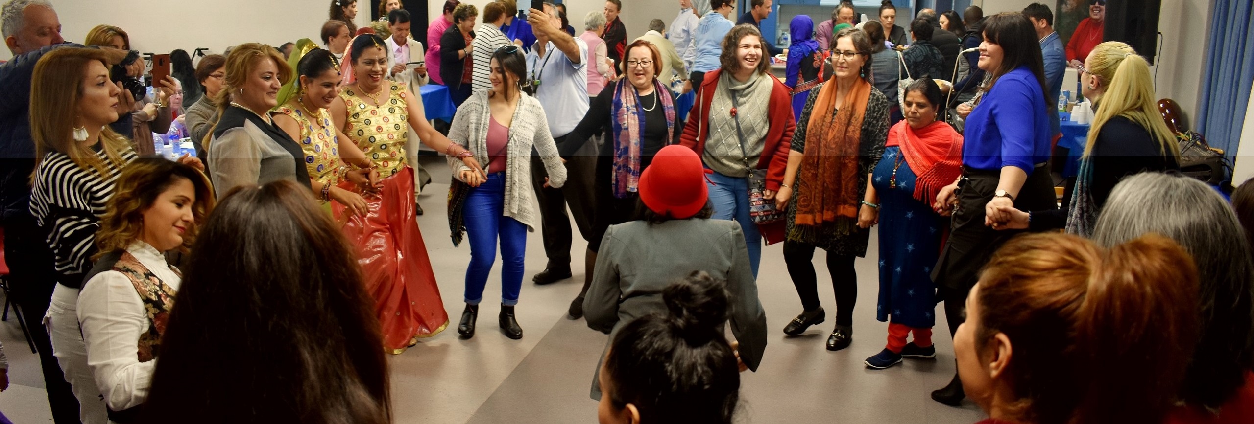 Group of people dancing in a circle