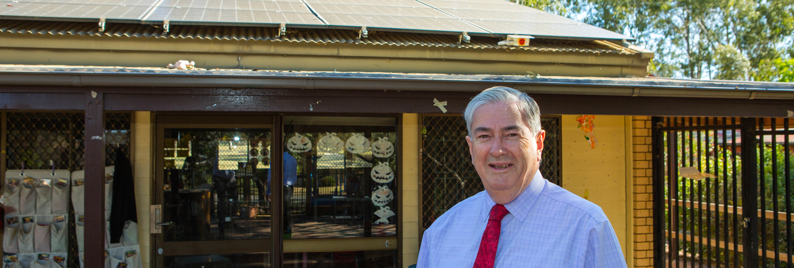 Mayor Cr Ross Fowler OAM shows off solar panels