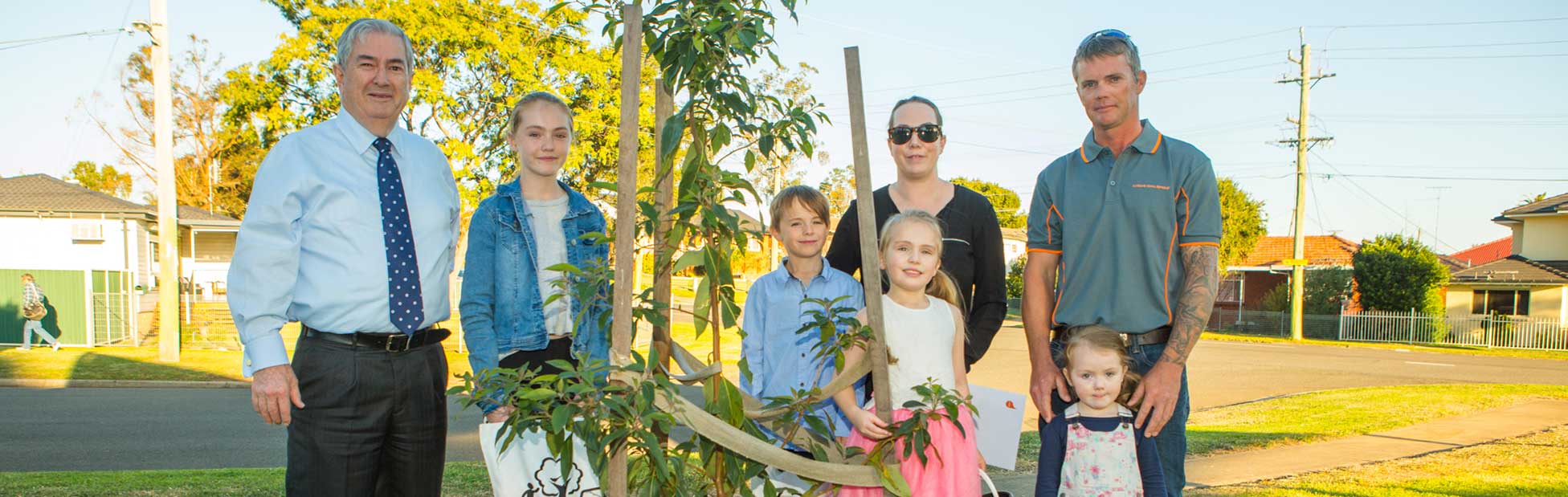 Penrith Mayor Ross Fowler OAM with the Moy family of St Marys who are excited about receiving their street tree.