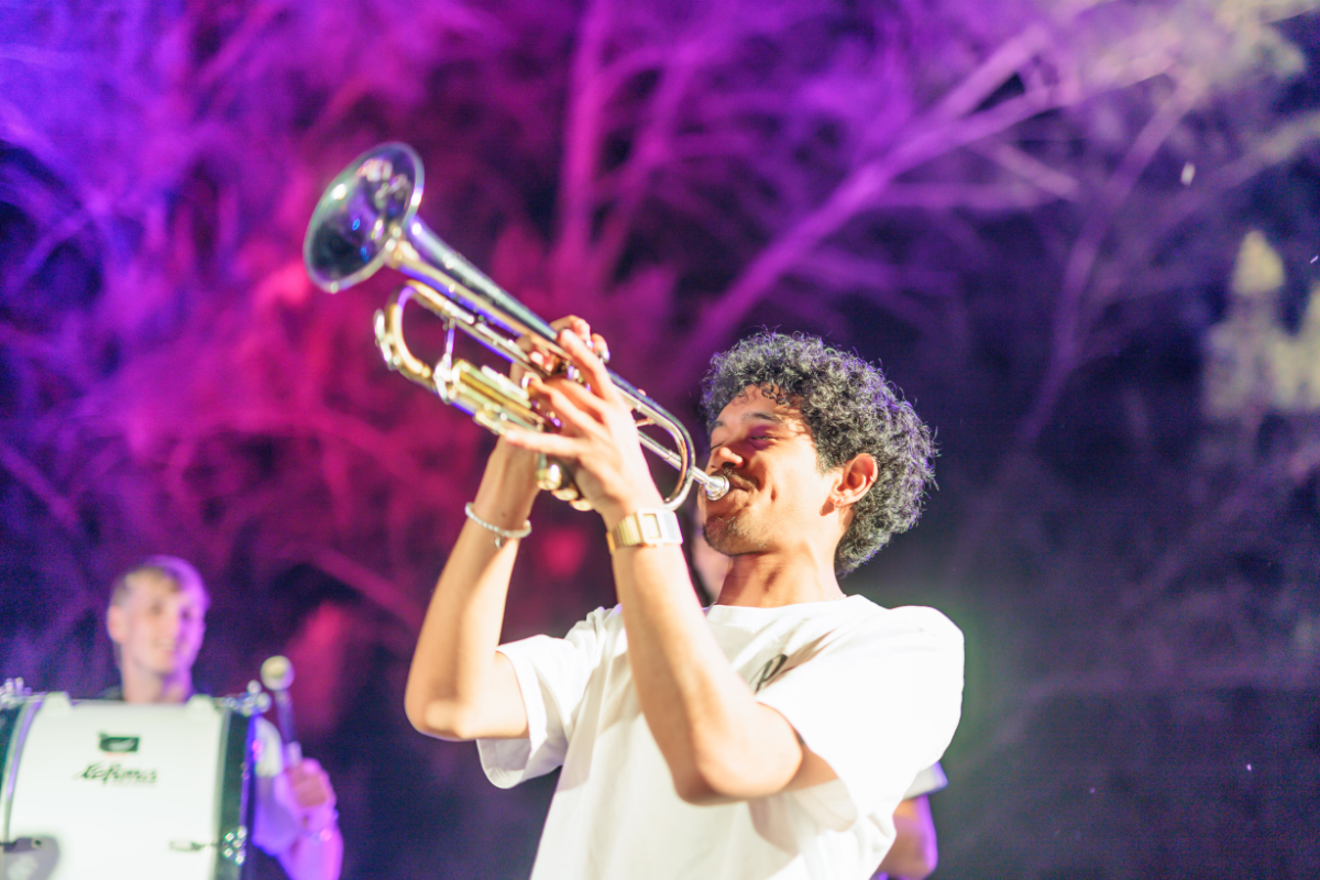 man blowing trumpet