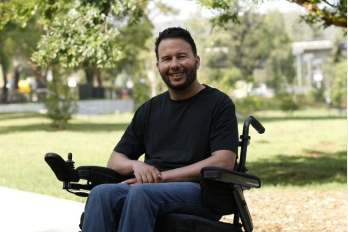 man in wheelchair smiling